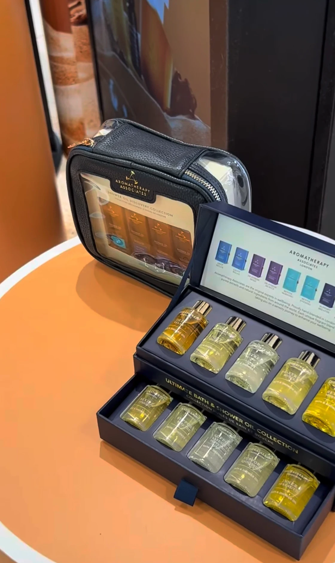 John Lewis product detail showing Aromatherapy Associates oils on an amber display podium